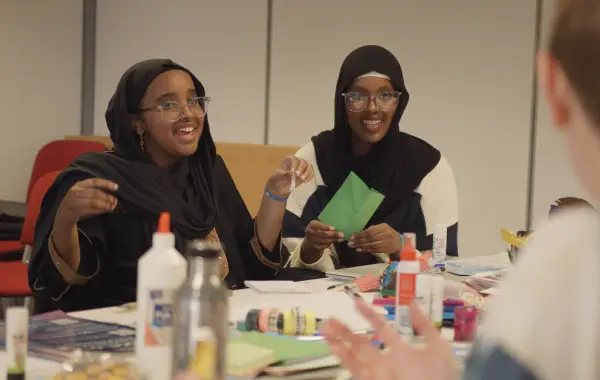 Two members of the Young People's Advisory Group attending a workshop