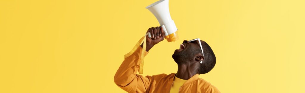 A man shouting into a megaphone